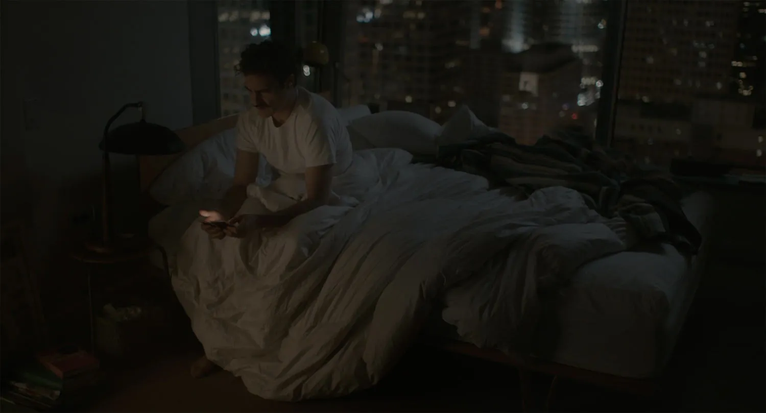 Person waking up and checking phone