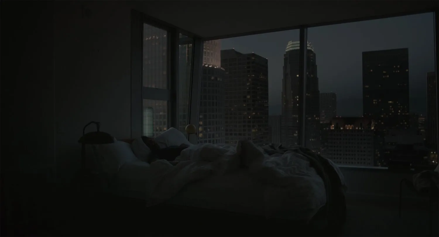 Person in bedroom using device